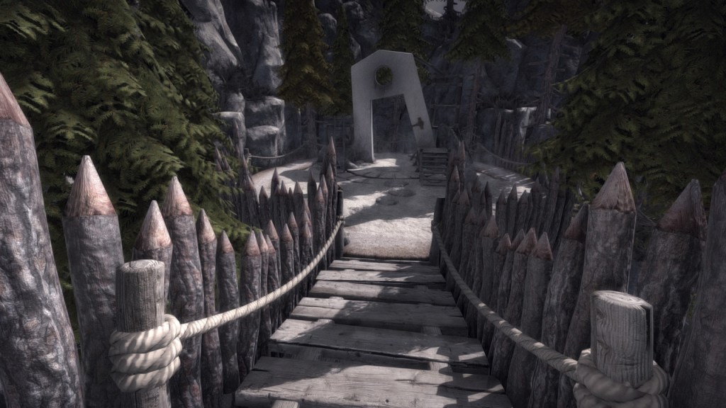 Un ponte di legno conduce a una porta circolare in un paesaggio montano con alberi.